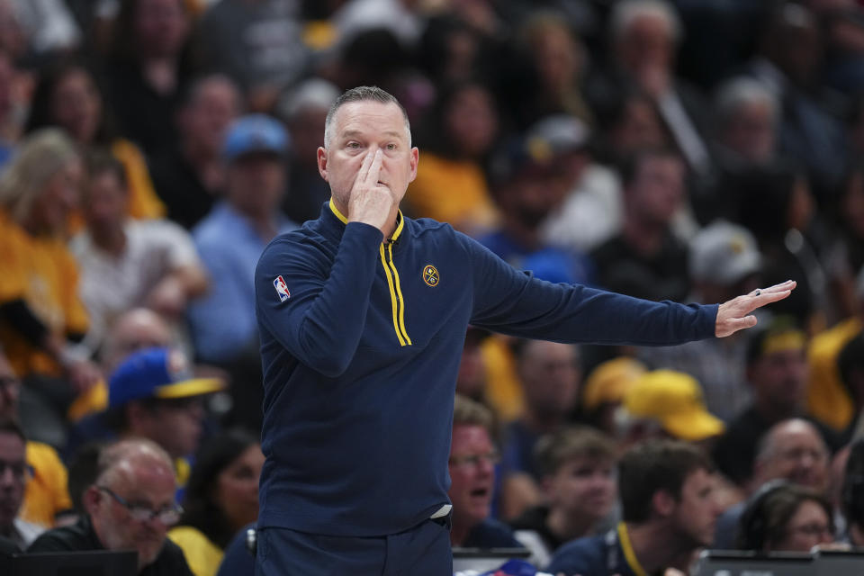 Denver Nuggets coach Michael Malone gestures during the first half of Game 1 of the basketball team's NBA Finals against the Miami Heat, Thursday, June 1, 2023, in Denver. (AP Photo/Jack Dempsey)