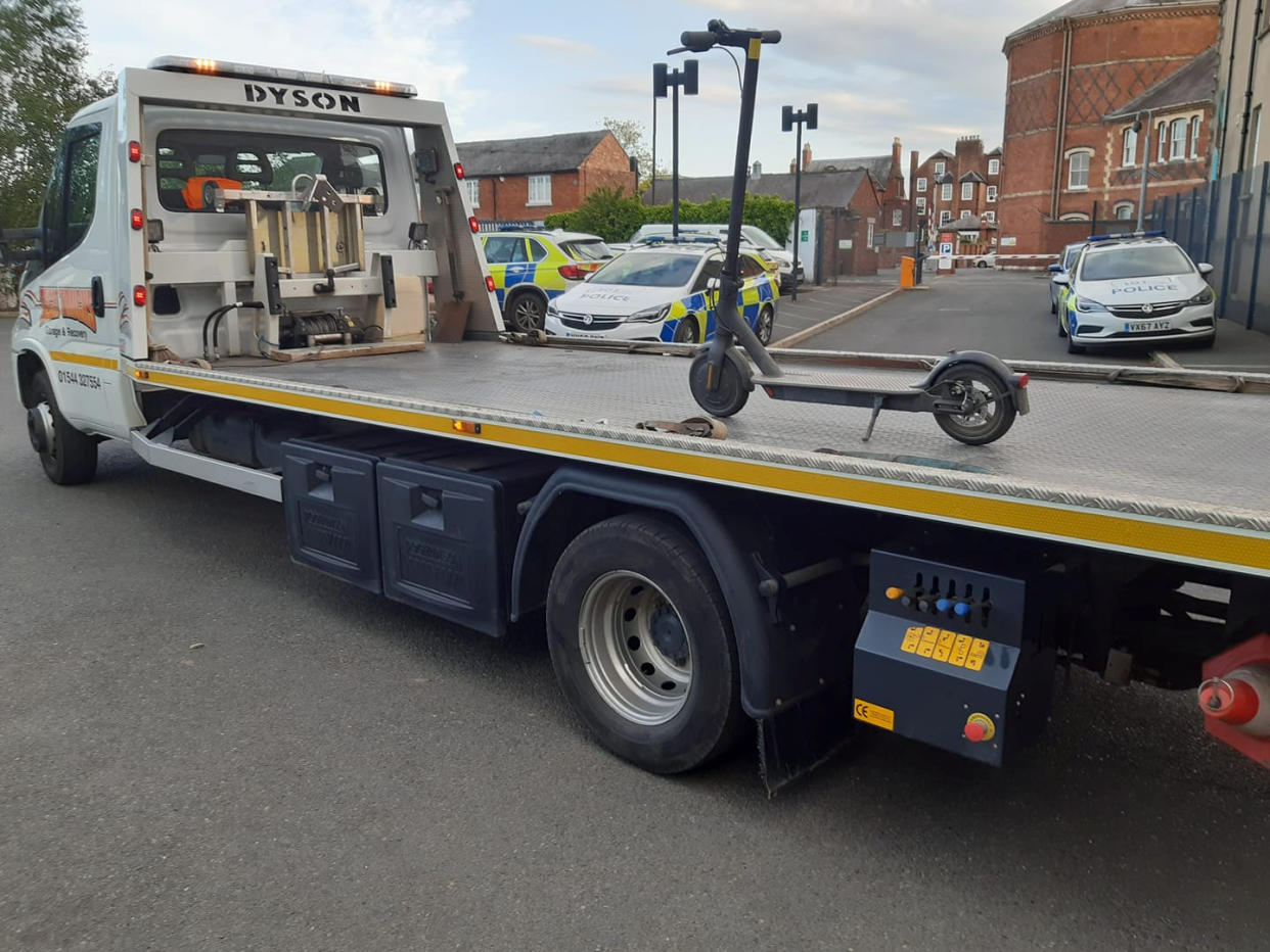 A police force has been mocked on social media for using a 7.5 tonne recovery truck to tow away an electric scooter. (SWNS)