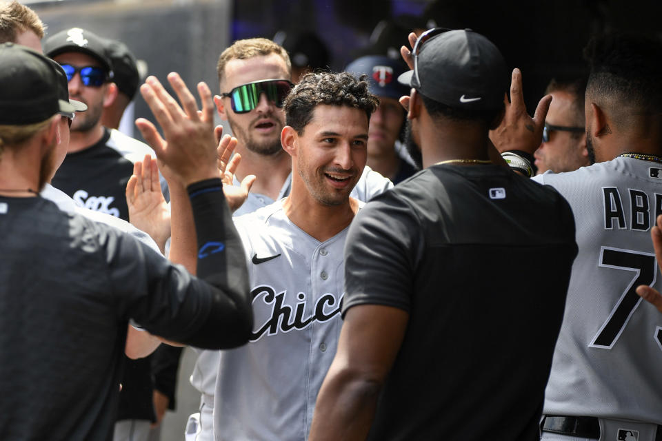 Chicago White Sox's Seby Zavala, center, celebrates after scoring on a Tim Anderson two-run single against the Minnesota Twins during the fifth inning of a baseball game, Sunday, July 17, 2022, in Minneapolis. Adam Engel also scored. (AP Photo/Craig Lassig)