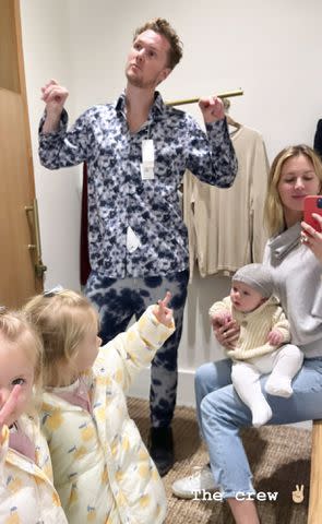 Tessa and Barron Hilton with their kids in a dressing room