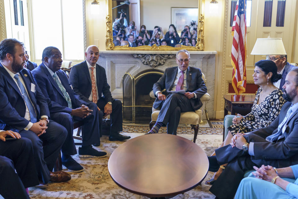 Senate Majority Leader Chuck Schumer, D-N.Y., joined by Rep. Chris Turner, left, chairman of the Texas House Democratic Caucus, meets with Democratic members of the Texas Legislature who are trying to kill a Republican bill in Austin that would make it harder to vote in the Lone Star State, at the Capitol in Washington, Tuesday, July 13, 2021. (AP Photo/J. Scott Applewhite)