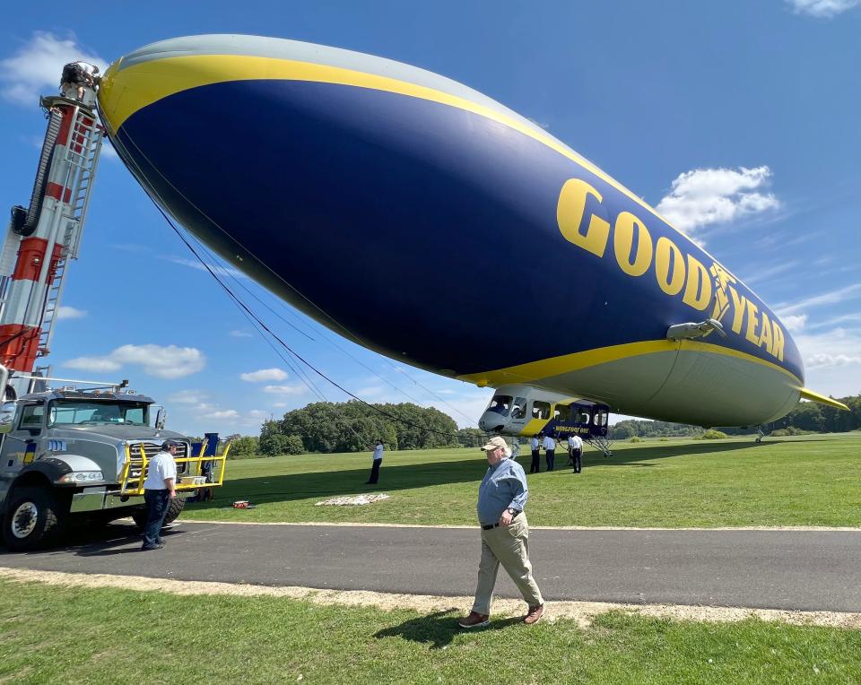 Akron historian Dave Lieberth heads to a shuttle bus after leading an aeriel tour of Akron from the Goodyear blimp on Tuesday, August 29, 2023 in Suffield, Ohio. [Phil Masturzo/ Beacon Journal]