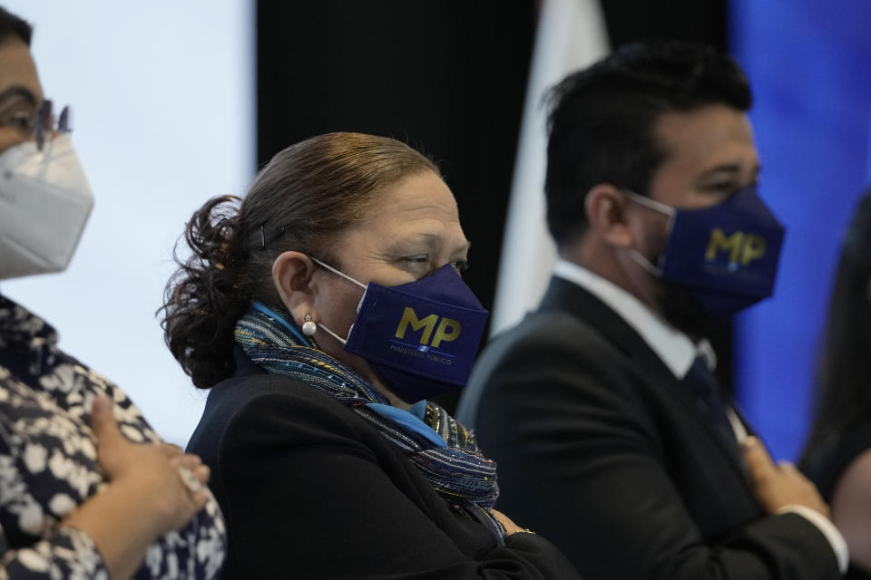 Guatemalan Attorney General Consuelo Porras, who is seeking another four year term, listens to her nation's anthem before delivering her fourth annual report in Guatemala City, Monday, May 16, 2022. President Alejandro Giammattei is expected to choose a new attorney general as Porras' four-year term ends Monday. (AP Photo/Moises Castillo)