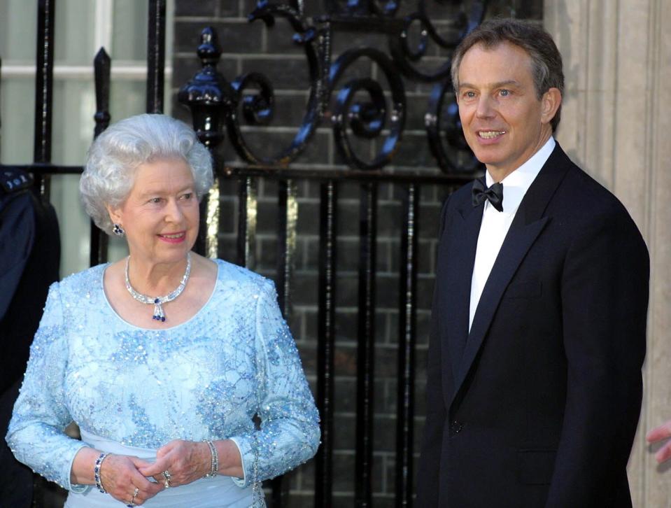 British Prime Minister Tony Blair stands with Queen Elizabeth II outside 10 Downing Street, where Mr Blair was hosting a celebratory royal Golden Jubilee dinner. The Queen, the Duke of Edinburgh and four former Prime Ministers were attending. * ... along with the relatives of five other prime ministers who held power during the Queen's 50-year reign but have since died.