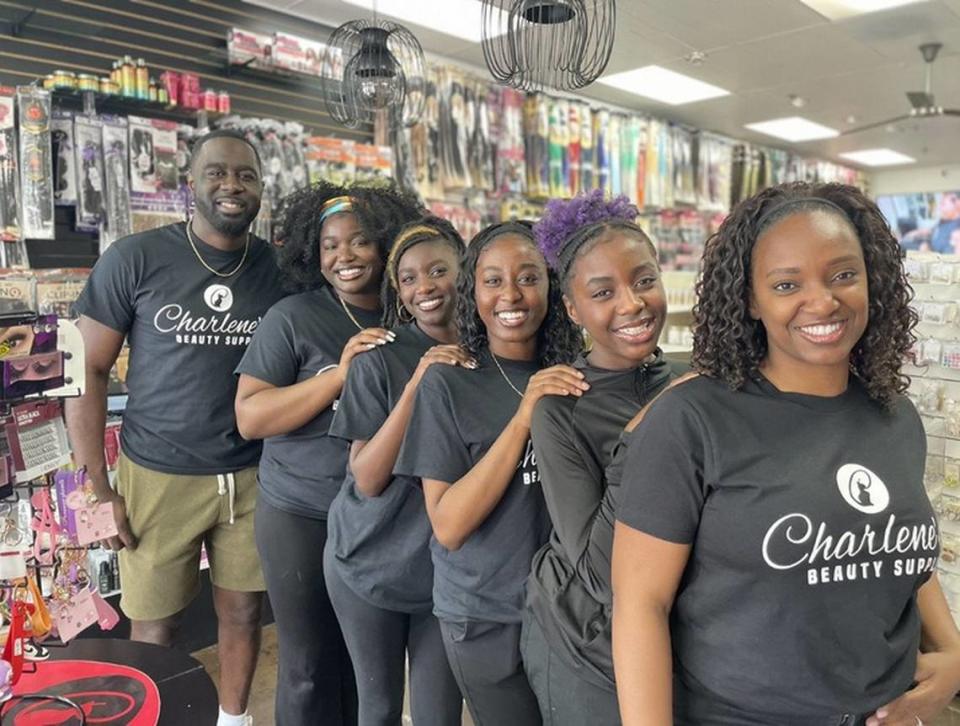 The Haynes family, from front to back, Charlotte Haynes, Jurnee Haynes, Justice Haynes, Jada Haynes, Jazmine Haynes, and Chris Haynes pose inside of Charlene’s Beauty Supply.
