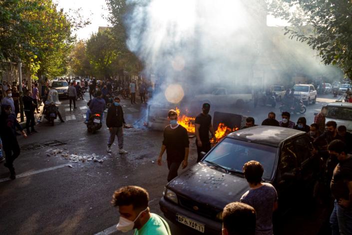 Iranians protest the death of 22-year-old Mahsa Amini after she was detained by the morality police last month, in Tehran, Thursday, Oct.  27, 2022. (AP Photo/Middle East Images, File) (Copyright 2022 The Associated Press. All rights reserved.)