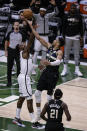 Milwaukee Bucks forward Giannis Antetokounmpo (34) shoots against the Brooklyn Nets during the second half of Game 6 of a second-round NBA basketball playoff series Thursday, June 17, 2021, in Milwaukee. (AP Photo/Jeffrey Phelps)