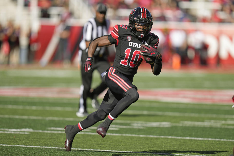 Utah wide receiver Money Parks (10) carries the ball during the first half of an NCAA college football game against Arizona State Saturday, Nov. 4, 2023, in Salt Lake City. (AP Photo/Rick Bowmer)