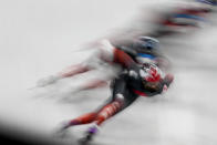 Members of the Canadian short track speedskating team train at the 2022 Winter Olympics, Thursday, Feb. 3, 2022, in Beijing. (AP Photo/Natacha Pisarenko)