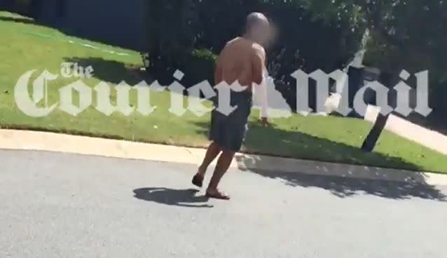 Shocking video has emerged of a grandfather covered in blood stumbling around a quiet suburban street in Brisbane after a brutal stabbing attack which killed his baby granddaughter. Photo: Courier Mail