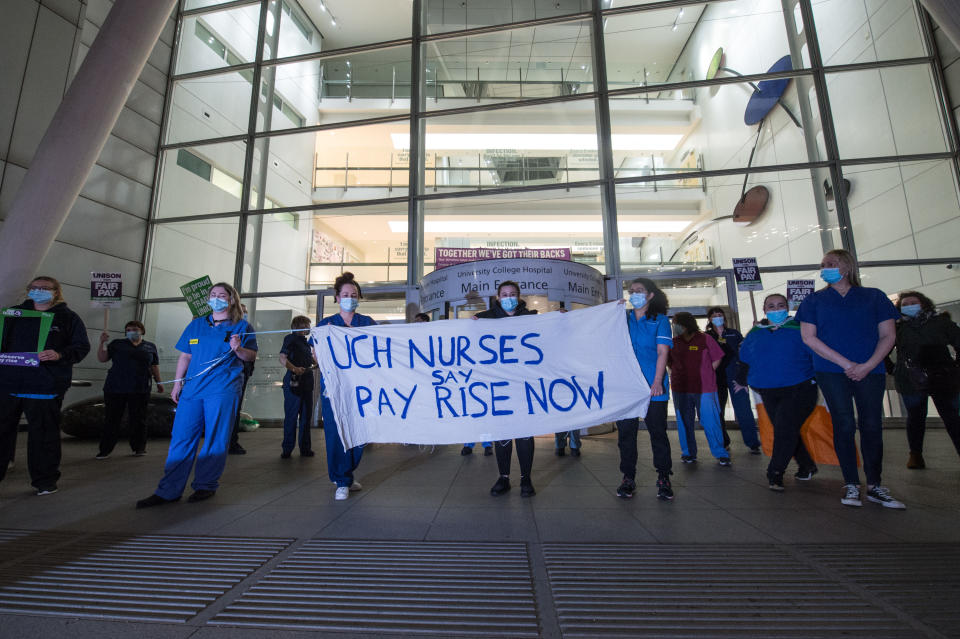 NHS staff are angered by the 1% pay rise after their hard work over the past year. Staff from University College Hospital protested with a slow hand clap in March 2021. (Getty Images)