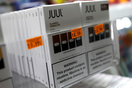 FILE PHOTO: Juul brand vaping pens are seen for sale in a shop in Manhattan in New York City, New York, U.S., February 6, 2019. REUTERS/Mike Segar/File Photo