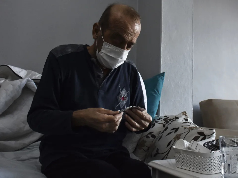 Muzaffer Kayasan, who was treated for leukemia, takes his medicine in his house in Istanbul, Turkiye on February 05, 2022.