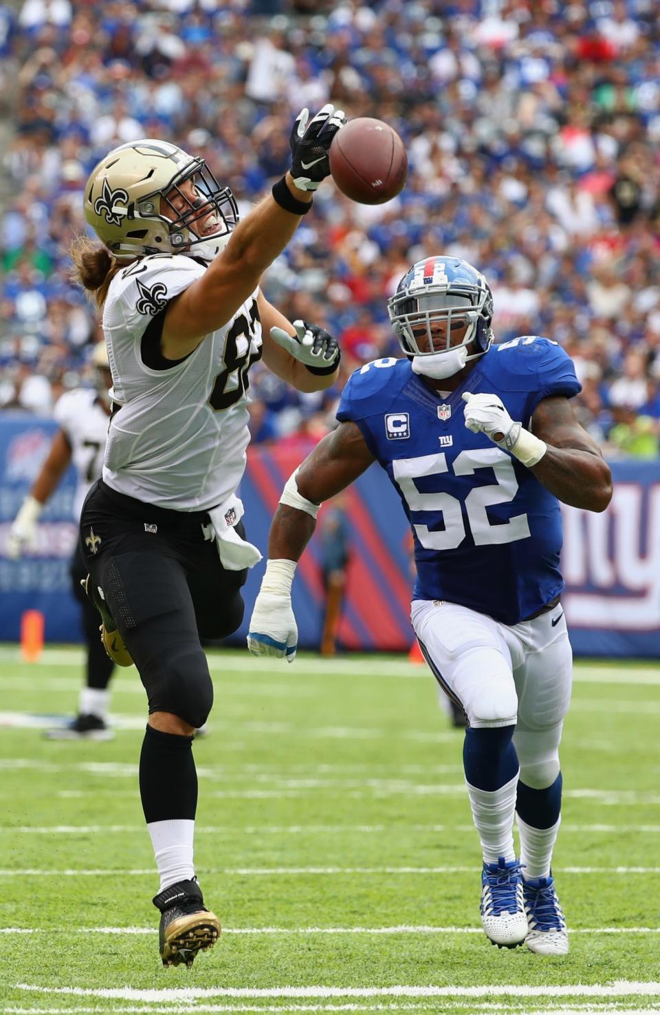 <p>Coby Fleener #82 of the New Orleans Saints reaches in an attempt to catch the ball against Jonathan Casillas #52 of the New York Giants during the first half at MetLife Stadium on September 18, 2016 in East Rutherford, New Jersey. (Photo by Al Bello/Getty Images) </p>