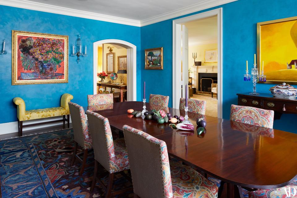 “We use this room in several ways,” says Ms. Clinton of her formal dining room. “We have actual dinners, buffets, or, sometimes, cocktail parties. And when I was Secretary of State, I had a memorable dinner there. All the foreign secretaries from what was then called the G8. The Brits, the French, the Germans and the Russians.” More recently, Ms. Clinton recounts, her two grandchildren like to play in this room, too, running “from one end of to the next, and out the door into the backyard.” Howe first had the walls painted in Benjamin Moore 2054-40 Blue Lagoon and then had them “aged” for added depth—the better to showcase the Russian still life painting Ms. Clinton’s mother and brother had purchased on a trip to Moscow some years ago, as well as the colorful Kent Willy pattern rug from an Azerbaijani workshop. Wanting her guests to feel comfortable at her dining room table, Ms. Clinton decided on a floor covering that is colorful, vibrant, and ultimately forgiving should someone spill something.