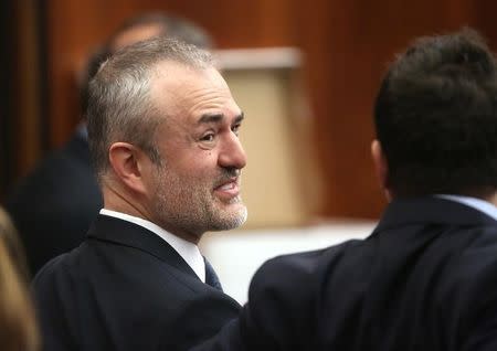 Nick Denton, founder of Gawker, talks with his legal team before Terry Bollea, aka Hulk Hogan, testifies in court, in St Petersburg, Florida March 8, 2016. REUTERS/Tampa Bay Times/John Pendygraft/Pool