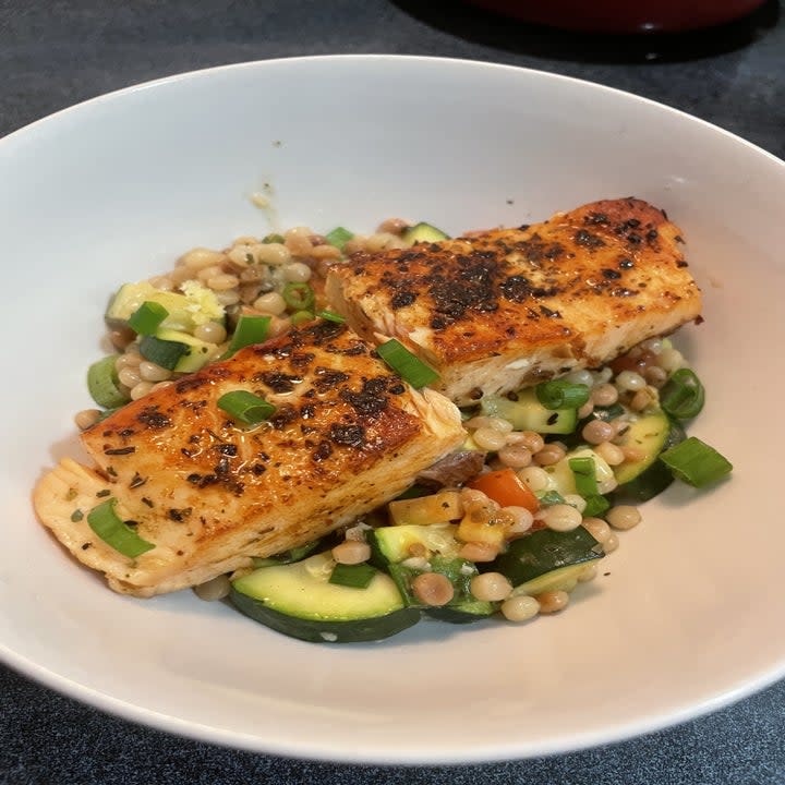 Salmon on a plate with vegetables, looking delicious