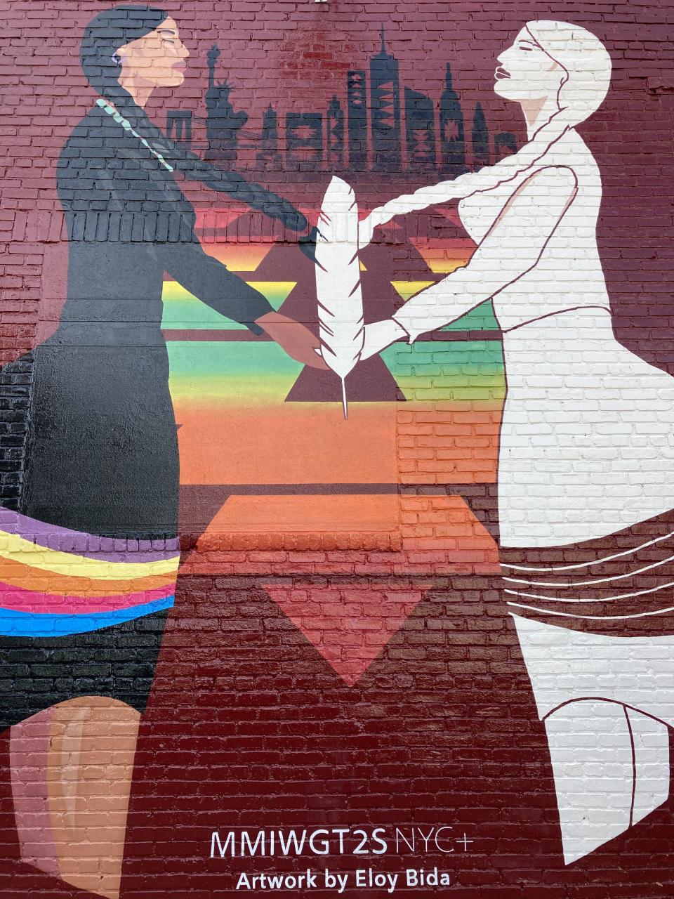 Urban Indigenous Collective's mural in Brooklyn depicts two figures, with one colorless to represent people affected by the Missing and Murdered Indigenous Peoples crisis. A QR code painted on the mural directs people to resources for Native people, including a policy tracker, when they scan it with their phones.