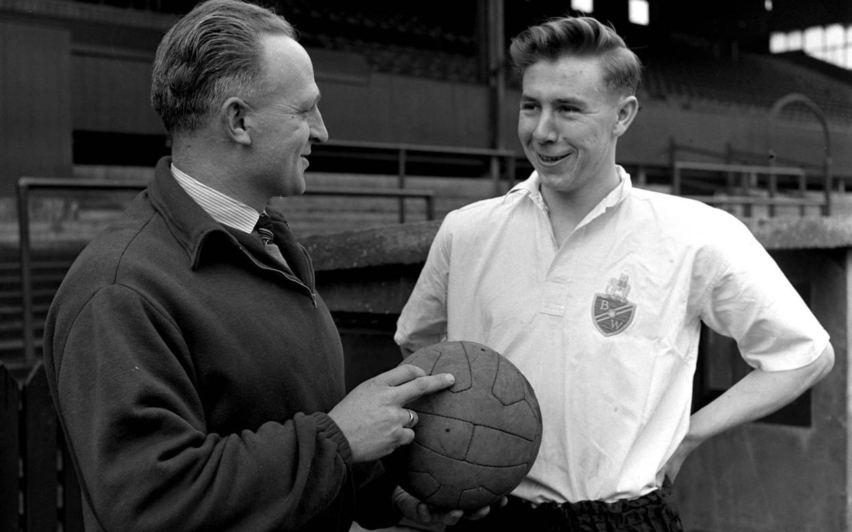 Doug Holden, right, in 1953 with the Bolton Wanderers trainer Bert Sproston - Popperfoto via Getty Images