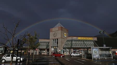 A rainbow is seen over Morrisons supermarket in Fort William, Scotland August 31, 2014. REUTERS/Russell Cheyne