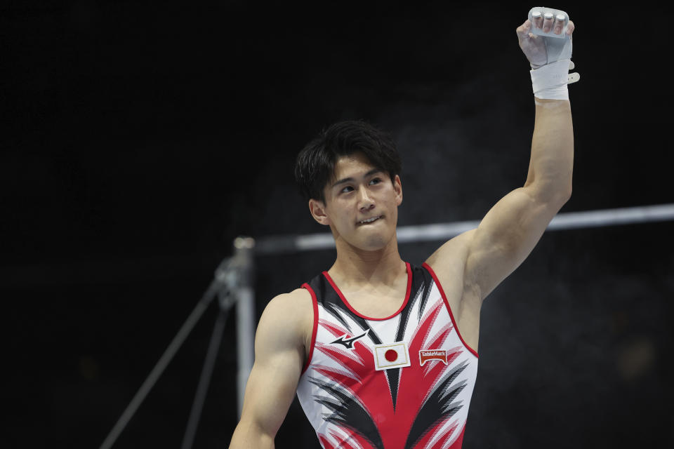 Japan's Daiki Hashimoto celebrates after his horizontal bar exercise during the apparatus finals at the Artistic Gymnastics World Championships in Antwerp, Belgium, Sunday, Oct. 8, 2023. (AP Photo/Geert vanden Wijngaert)