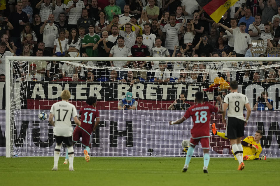 Colombia's Juan Cuadrado, second left, scores his side's second goal from the penalty spot during an international friendly soccer match between Germany and Colombia at Veltins-Arena, in Gelsenkirchen, Germany, Tuesday, June 20, 2023. (AP Photo/Martin Meissner)