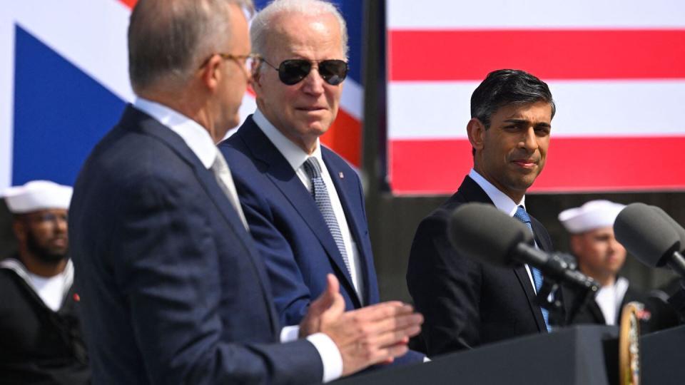 From left, Australian Prime Minister Anthony Albanese, U.S. President Joe Biden and British Prime Minister Rishi Sunak hold a news conference during the AUKUS summit on March 13, 2023, at Naval Base Point Loma in San Diego Calif. (Jim Watson/AFP via Getty Images)