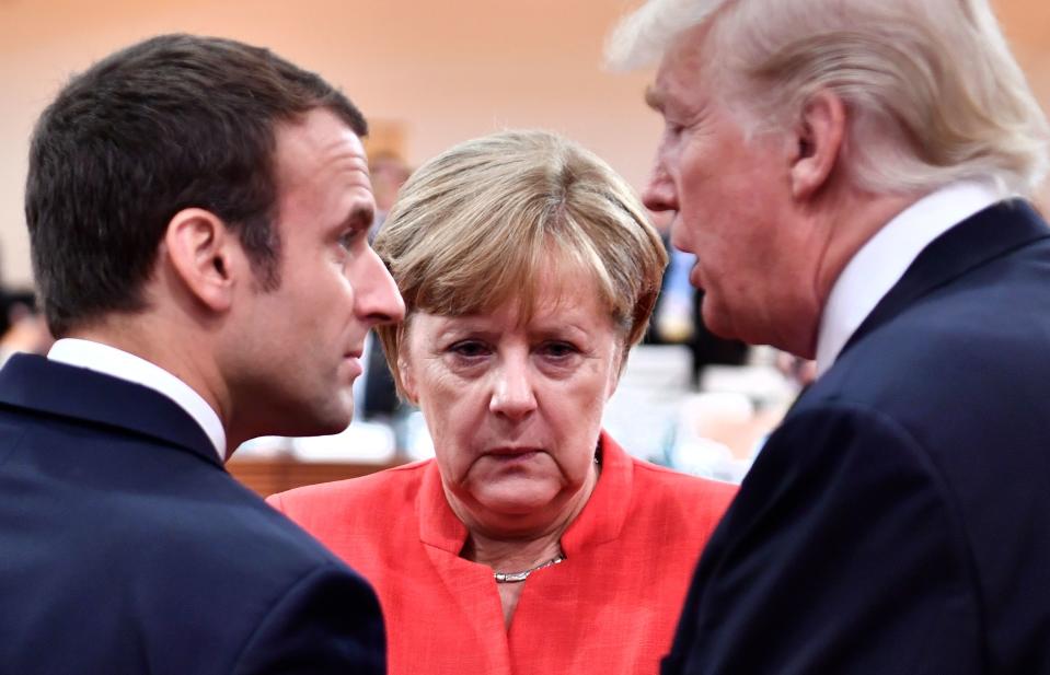 L-R) French President Emmanuel Macron, German Chancellor Angela Merkel and US President Donald Trump. Photo: JOHN MACDOUGALL/AFP/Getty Images