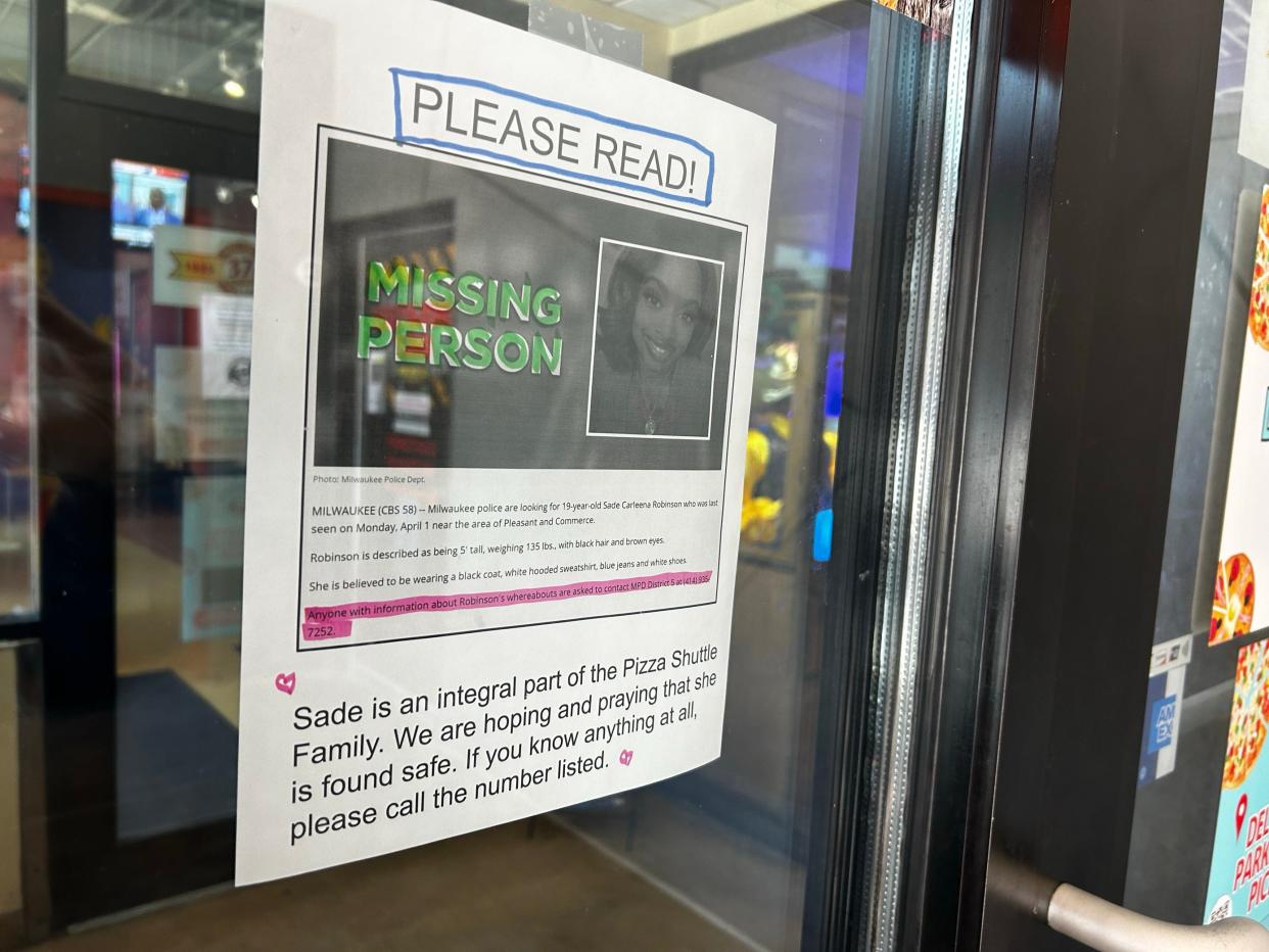 A missing poster for Sade Carleena Robinson is seen April 8, 2024, at Pizza Shuttle on Milwaukee’s east side, where Robinson worked for three years.