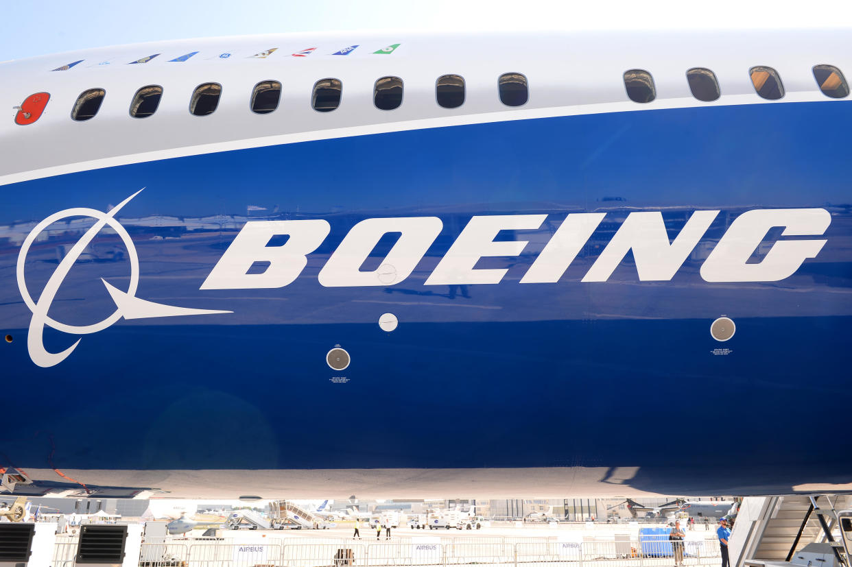 The Boeing logo is seen on the fuselage of a Boeing 787-10 Dreamliner test plane. / Credit: Eric Piermont/AFP via Getty Images
