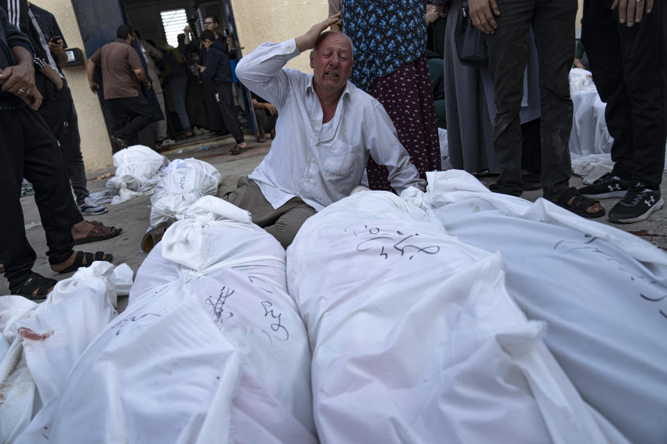 Palestinians mourn their relatives killed in the Israeli bombardment of the Gaza Strip at Al-Aqsa Hospital in Deir Al-Balah, Sunday, Oct. 22, 2023. ( AP Photo/Fatima Shbair)
