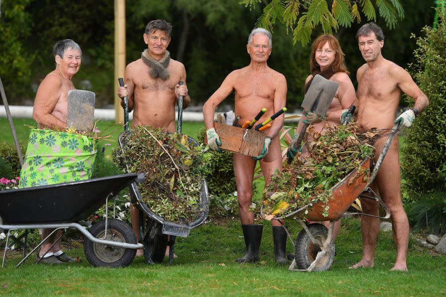 Gardeners pose for a group photo as they celebrate World Naked Gardening Day at the Wellington Naturist Club in Upper Hutt, Wellington on May 5, 2018. (Photo by MARTY MELVILLE/AFP via Getty Images)