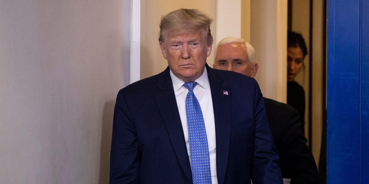 President Donald Trump, accompanied by Vice President Mike Pence, behind, arrives to speak during a briefing about the coronavirus in the James Brady Press Briefing Room of the White House, Sunday, March 15, 2020, in Washington. (AP Photo/Alex Brandon)