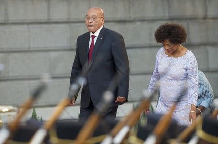 South Africa's President Jacob Zuma arrives with Speaker of Parliament Baleka Mbete to give his State of the Nation address at the opening session of Parliament in Cape Town, February 11, 2016. REUTERS/Rodger Bosch/Pool