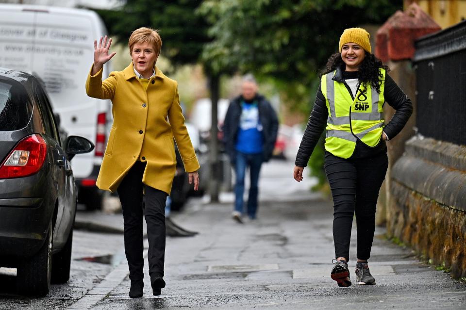 Scotland’s first minister Nicola Sturgeon and candidate Roza Salih walk near Annette Street School polling station in GlasgowJeff J Mitchell/Pool/Reuters