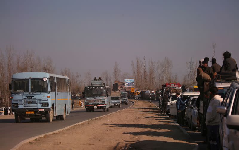 FILE PHOTO: Traffic is stopped as the Indian Central Reserve Police Force (CRPF) convoy moves along a national highway in Qazigund