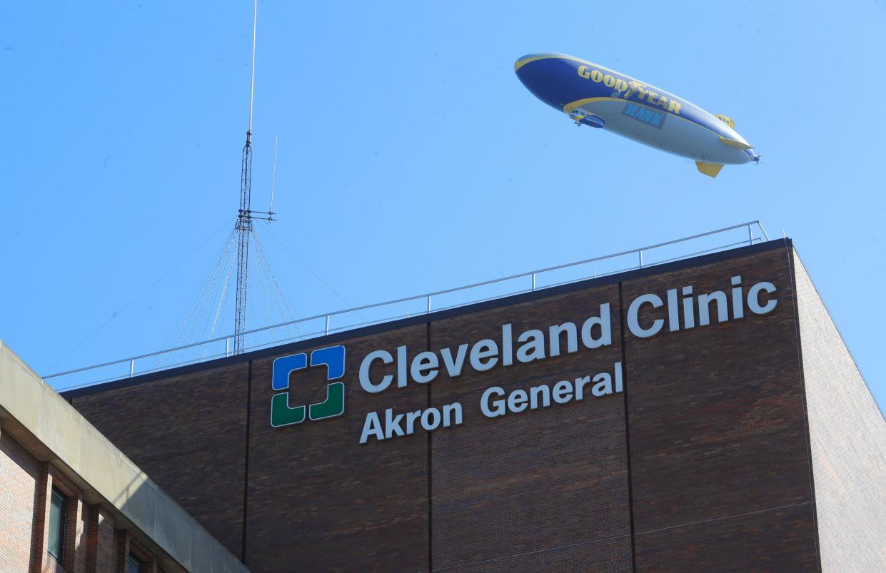 The Goodyear blimp flies over Cleveland Clinic Akron General. As coronavirus cases fill hospital beds, Cleveland Clinic has halted non-urgent inpatient surgeries.