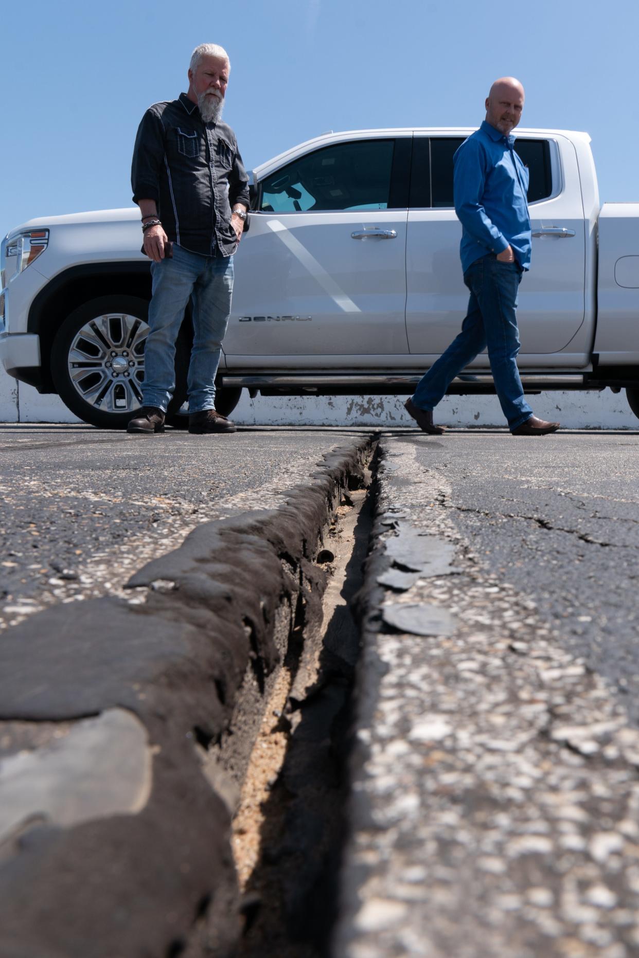 Heartland Motorsports Park's owner Chris Payne, right, hopes to reach a tax settlement with Shawnee County, but commissioners say Kansas law bans doing what he suggests.