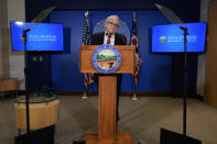 Ohio Gov. Mike DeWine apses as he speaks during a news conference, Friday, Dec. 29, 2023, in Columbus, Ohio. DeWine vetoed a measure Friday that would have banned gender-affirming care for minors and transgender athletes’ participation in girls and women’s sports, in a break from members of his party who championed the legislation. (AP Photo/Carolyn Kaster)