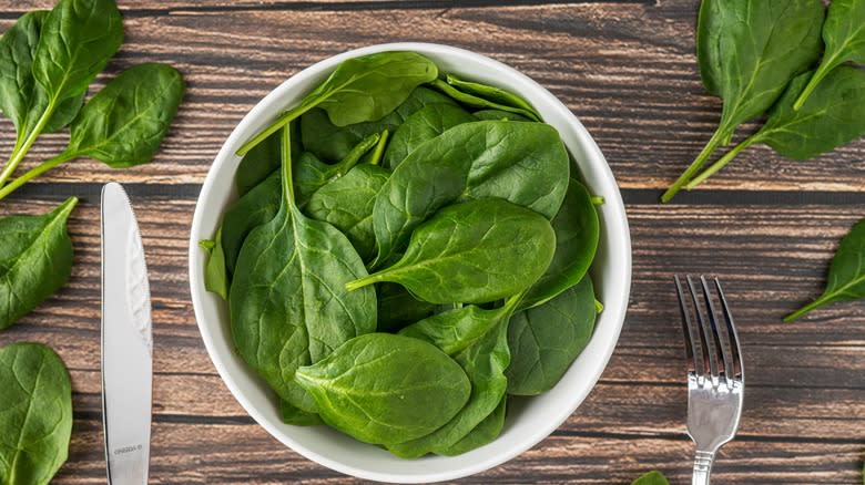 Baby spinach in white bowl