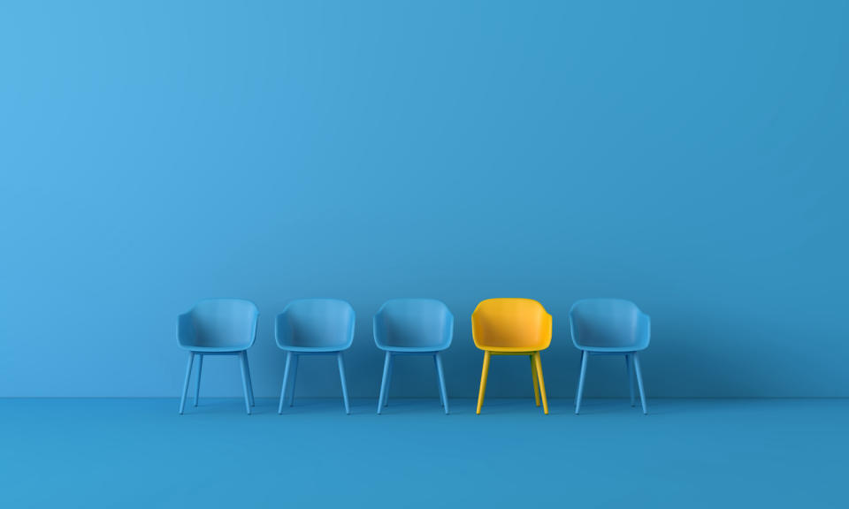 Yellow chair standing out from the crowd. Business concept. 3D rendering