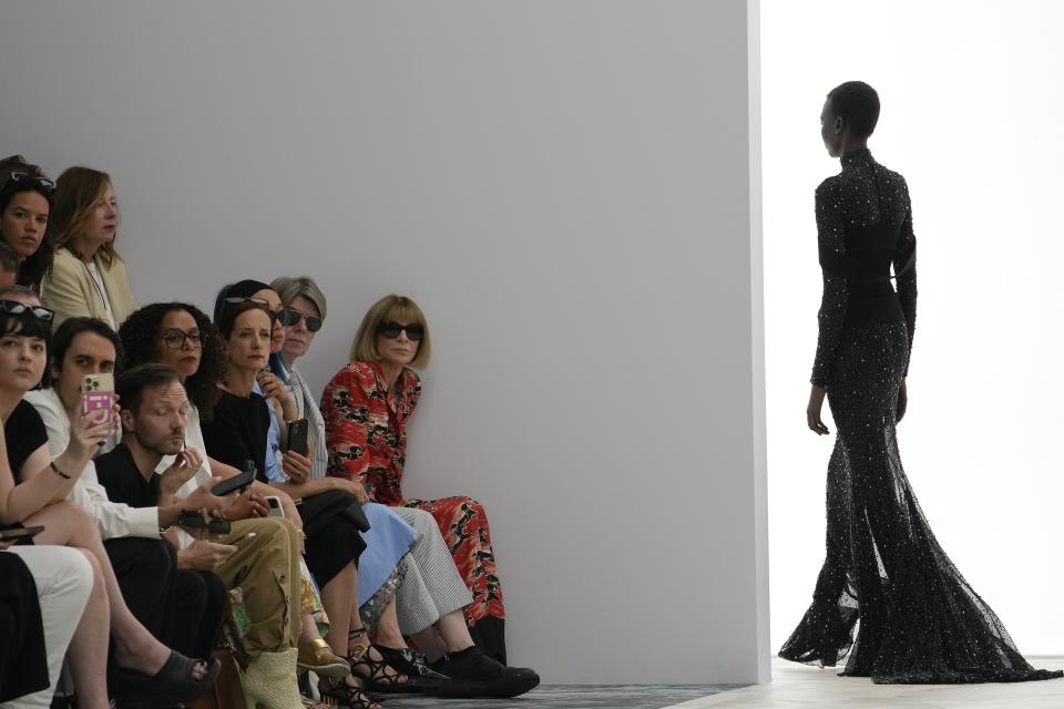 Anna Wintour, right on front row, watches the Fendi Haute Couture Fall/winter 2023-2024 fashion collection presented in Paris, Thursday, July 6, 2023. (AP Photo/Christophe Ena)