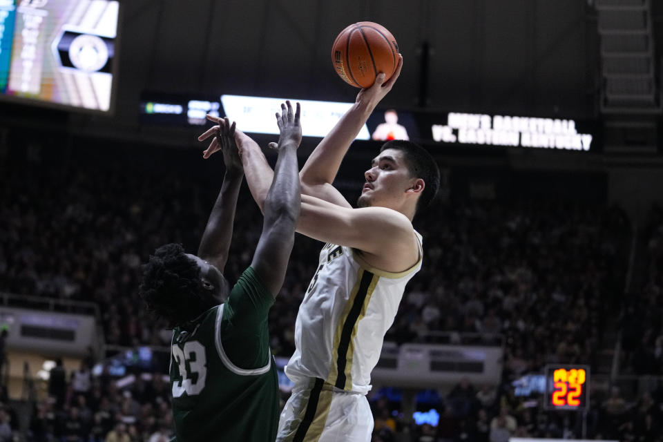Purdue center Zach Edey (15) shoots over Jacksonville forward Donovan Rivers (33) during the second half of an NCAA college basketball game in West Lafayette, Ind., Thursday, Dec. 21, 2023. (AP Photo/Michael Conroy)