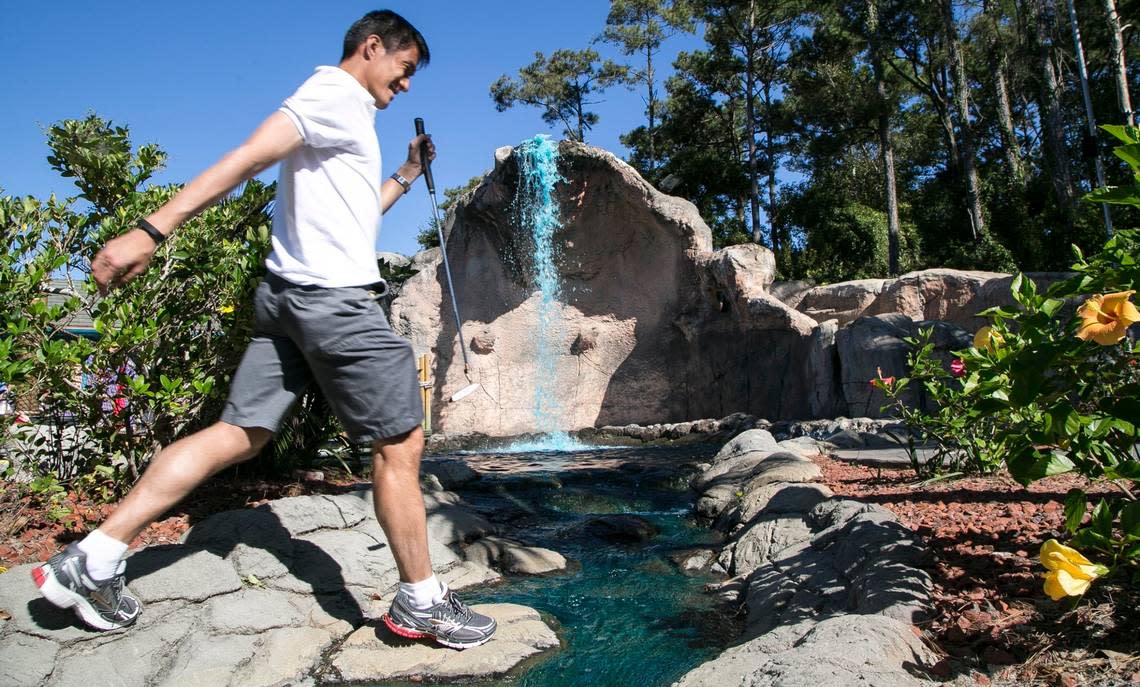 Eric Chiang jumps a water hazard at Hawaiian Rumble Mini Golf. The U.S. Pro Mini-Golf Association Masters Championship Tournament is being held at Hawaiian Rumble and Hawaiian Village this week with proceeds benefitting Canine Angels. JASON LEE/jlee@thesunnews.com