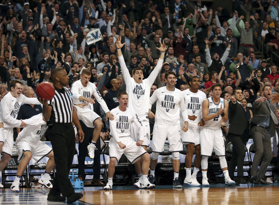 Players on the Villanova bench celebrates a Villanova basket against West Virginia during the second half of an NCAA men’s college basketball tournament regional semifinal Friday, March 23, 2018, in Boston. (AP Photo/Mary Schwalm)