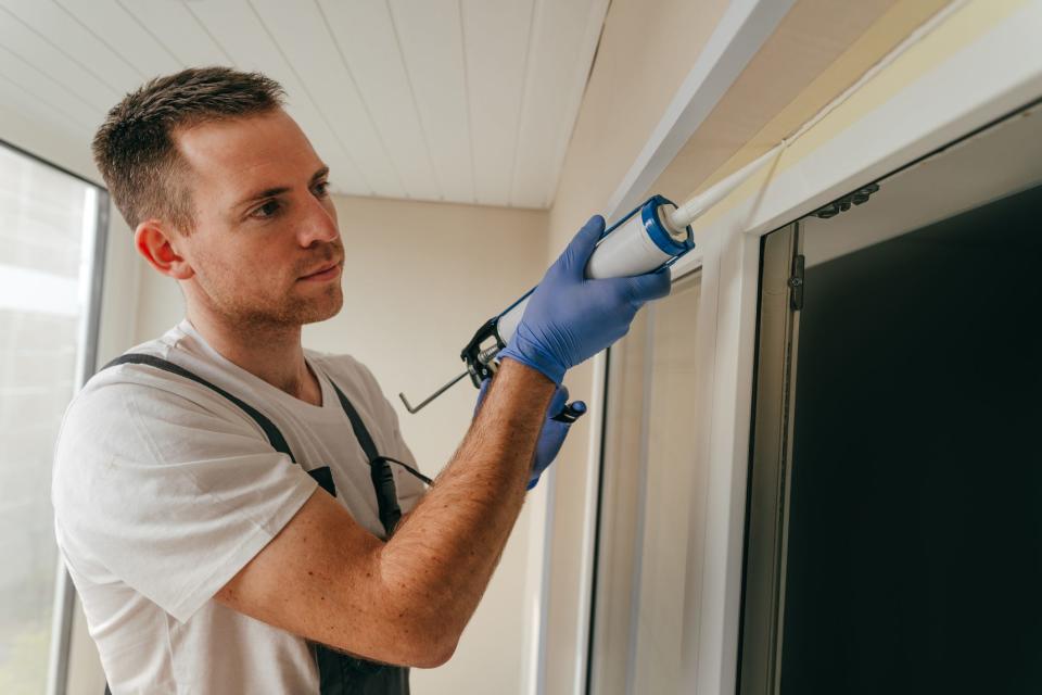 FILE: Replacing old caulking is one of many ways to help keep a home energy efficient.