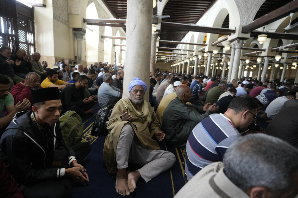FILE - Worshippers pray during Friday prayers at Al-Azhar mosque, the Sunni Muslim world's premier Islamic institution, during Ramadan in Cairo, Egypt, Friday, April 7, 2023. (AP Photo/Amr Nabil, File)