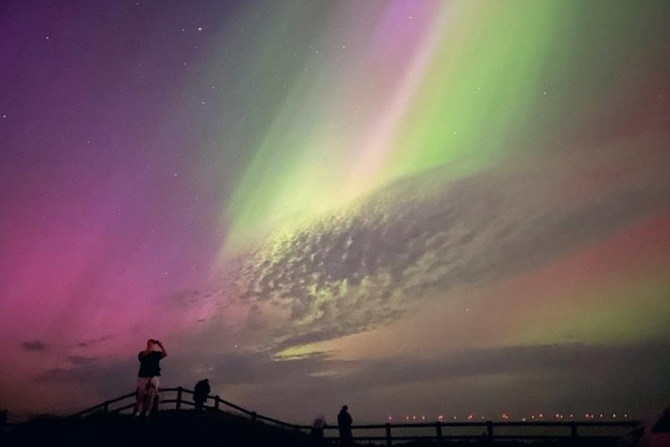 The Northern Lights glowing in the sky over Mappleton, East Yorkshire on Saturday 11 May as Britons get a rare glimpse of the stunning phenomenon (Sarah Sharpe/PA Wire)