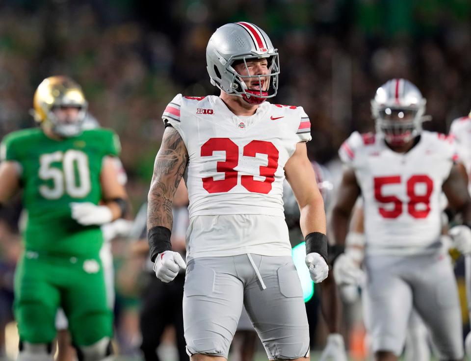 Ohio State defensive end Jack Sawyer celebrates after breaking up a pass from Notre Dame quarterback Sam Hartman.