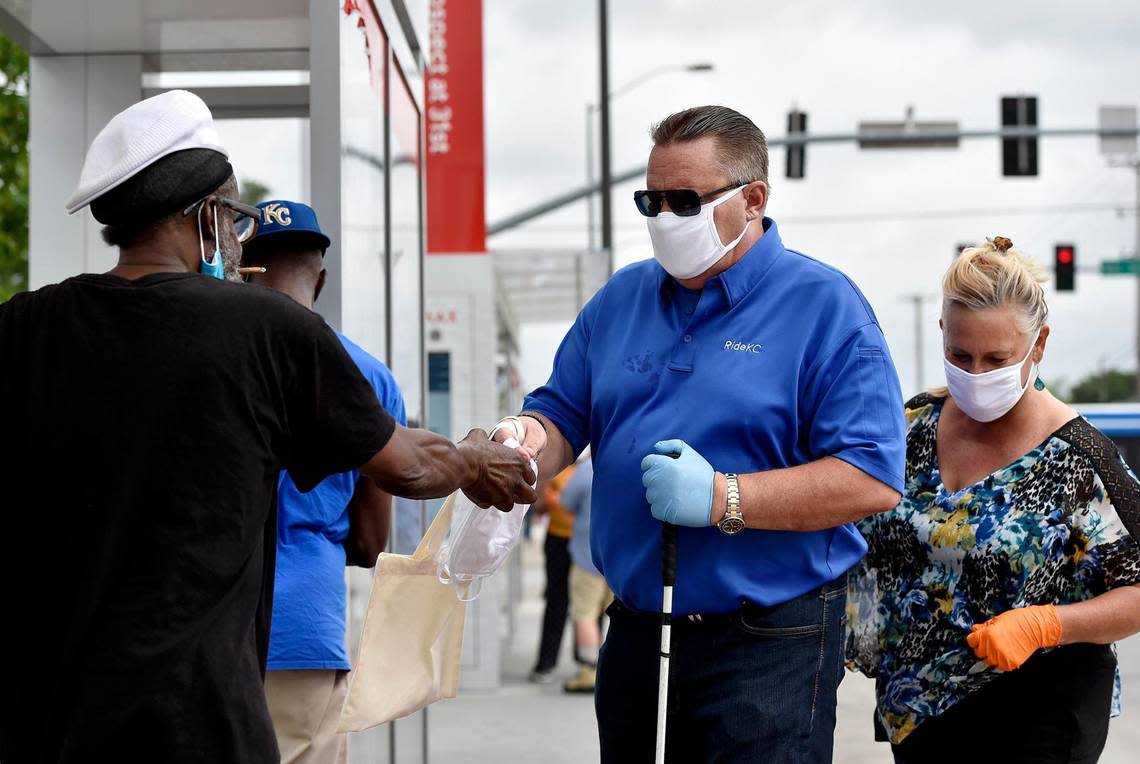 KCATA CEO Robbie Makinen gave masks away to bus riders at a stop at 31st Street and Prospect Avenue in late June. The city of Kansas City was the first jurisdiction in the area to make masks mandatory to curb the spread of COVID-19. CORONAVIRUSKC